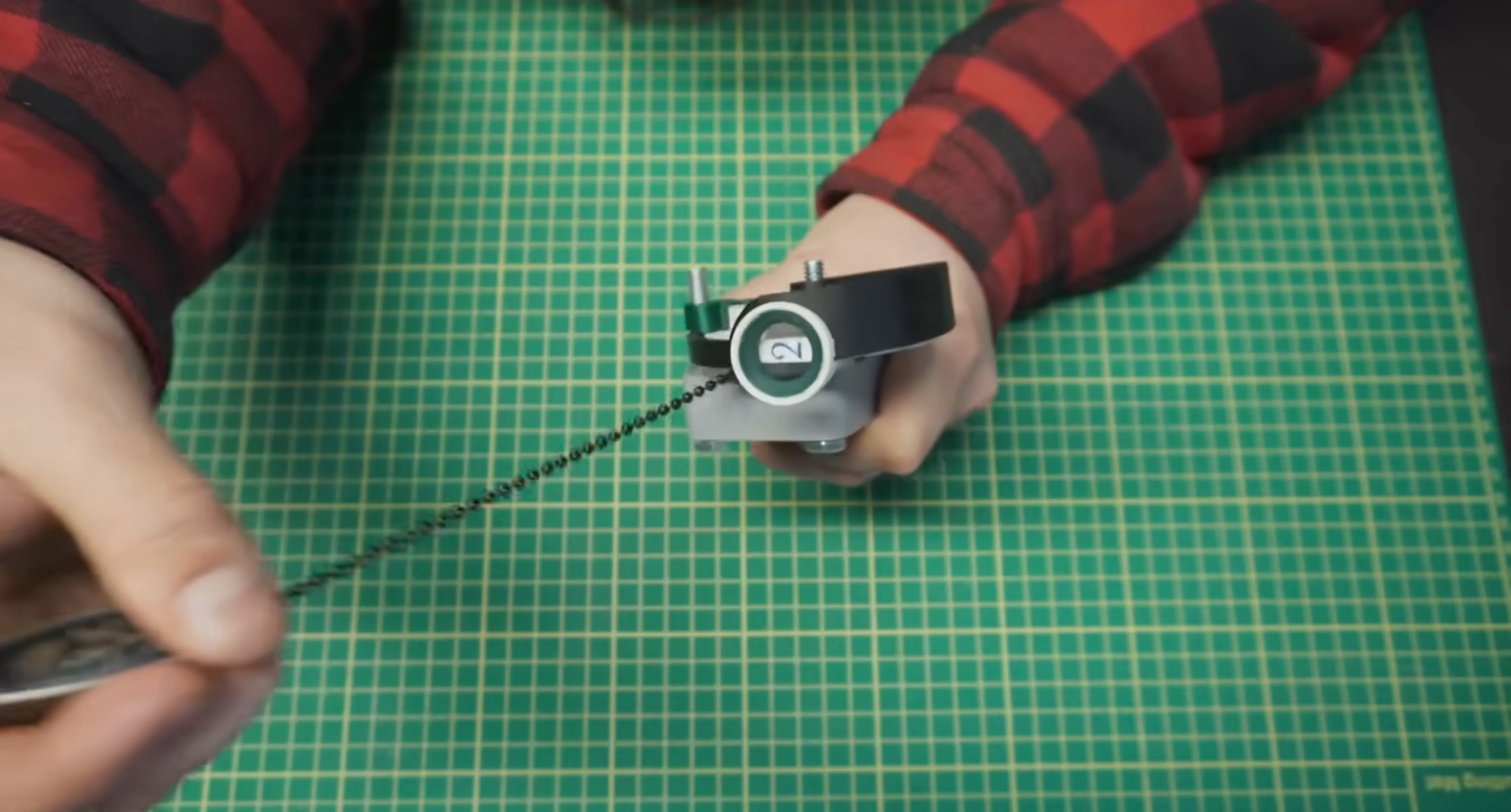 a ceiling fan chain connected to a pulley system