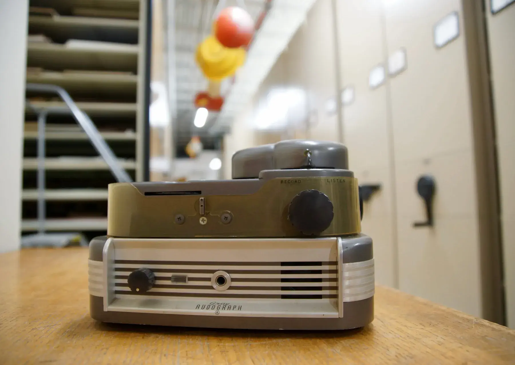 a gray metal box used to take dictation called an audograph