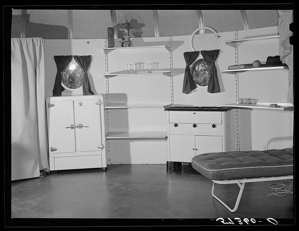 Interior of a house with rounded windows and open shelves.