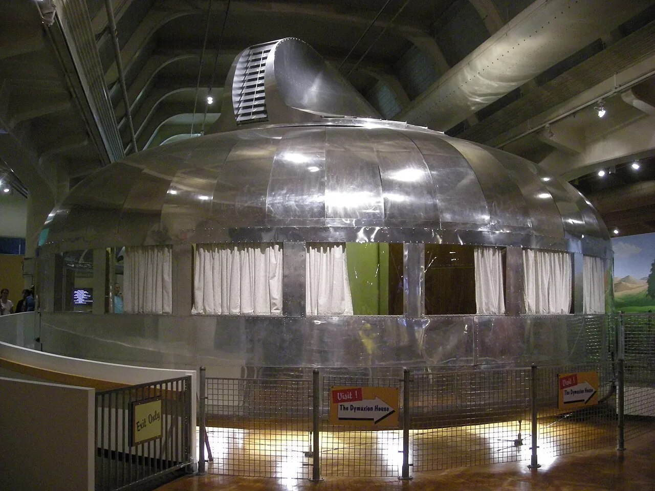 A round aluminum structure with windows across the middle and dome roof.